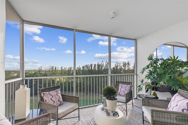 sunroom / solarium featuring a healthy amount of sunlight