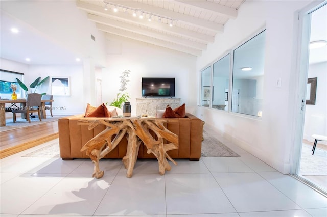 living room featuring wooden ceiling, lofted ceiling with beams, and light tile patterned floors