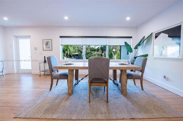 dining area with a healthy amount of sunlight and light wood-type flooring