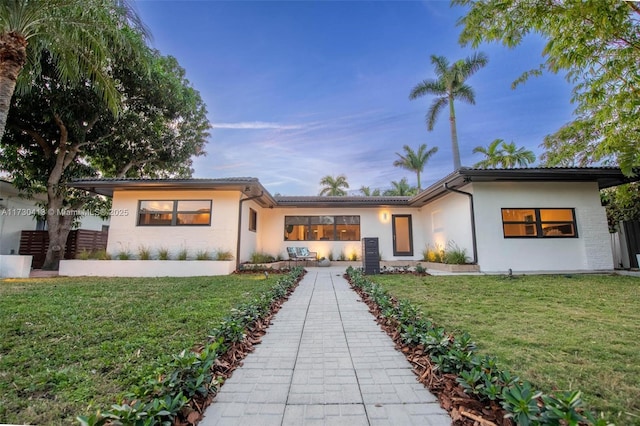 view of front of home featuring a yard