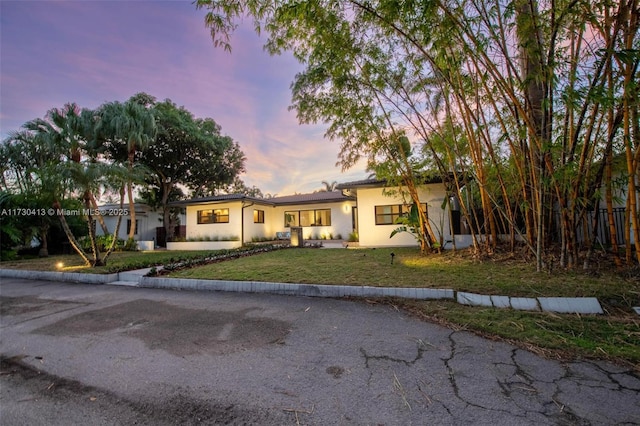 view of front of house with a lawn