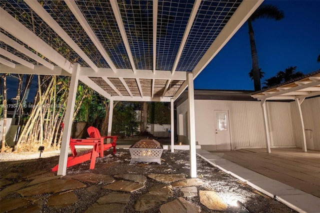 view of patio with a fire pit and a pergola