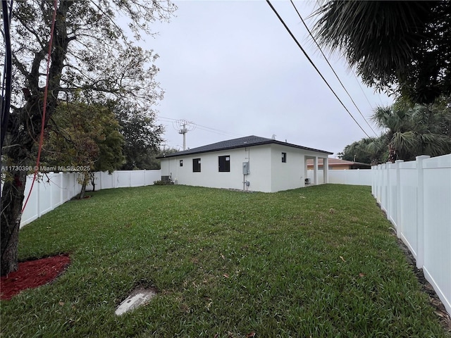 view of yard with a fenced backyard