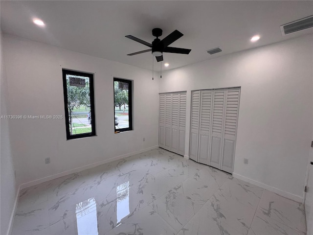 unfurnished bedroom with baseboards, marble finish floor, visible vents, and recessed lighting