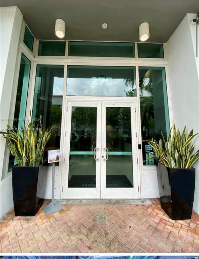 property entrance featuring french doors