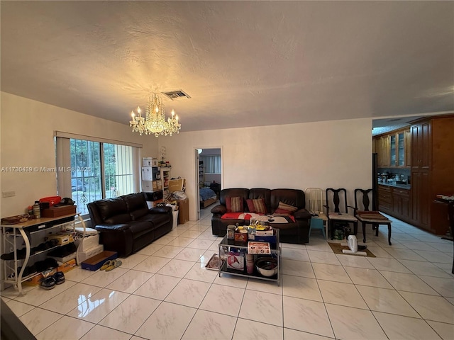 tiled living room featuring a chandelier