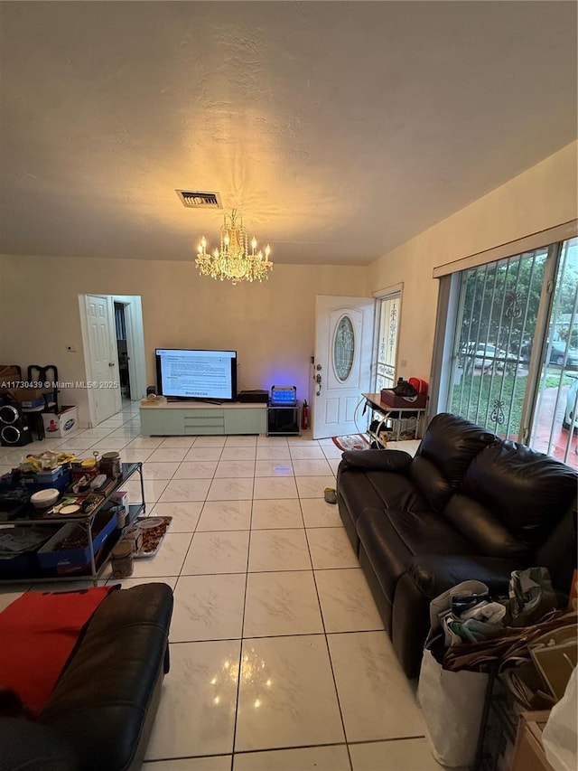 tiled living room with a chandelier