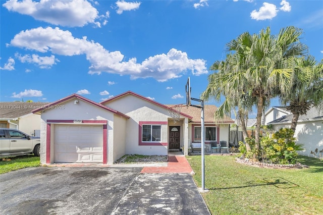 view of front of home featuring a garage and a front yard