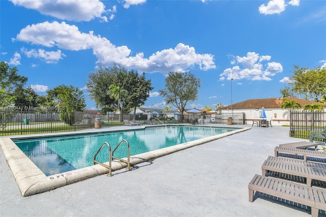 view of swimming pool featuring a patio area