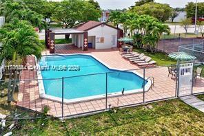 460 W Park Dr Unit 207, Miami, FL 33172 - pool with fence and a patio