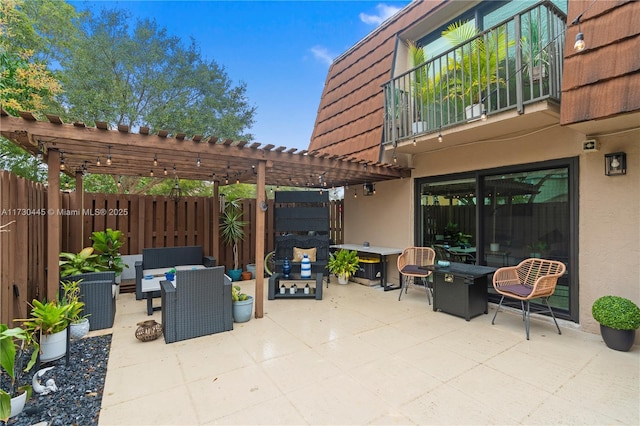 view of patio / terrace with fence, a pergola, and an outdoor living space with a fire pit