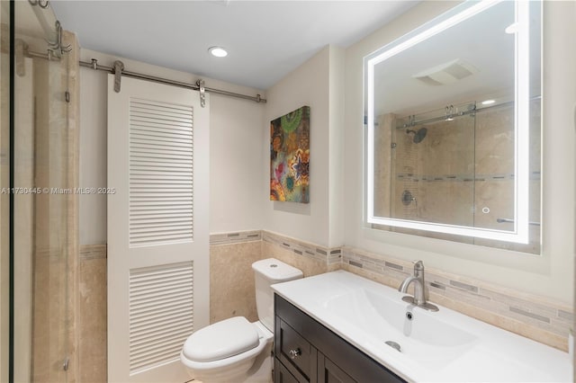 full bath featuring tile walls, visible vents, toilet, a stall shower, and vanity