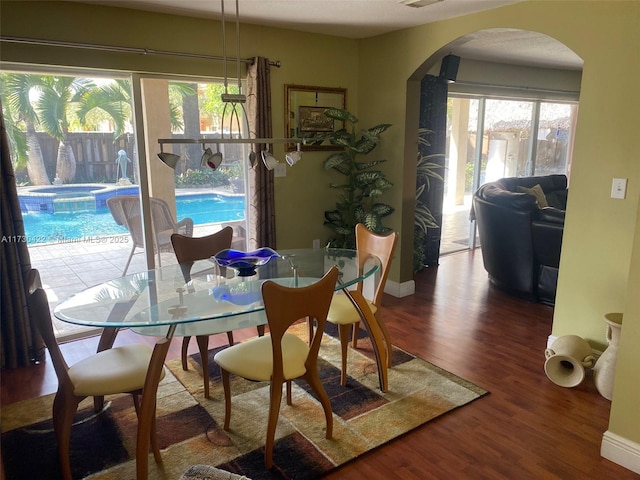 dining area with wood-type flooring