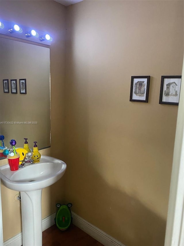 bathroom with hardwood / wood-style floors