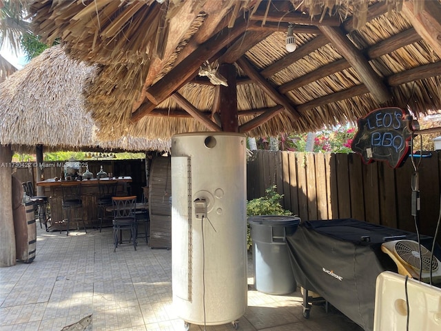 view of patio featuring a gazebo and a bar