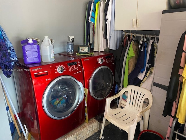 laundry area with cabinets and washer and dryer