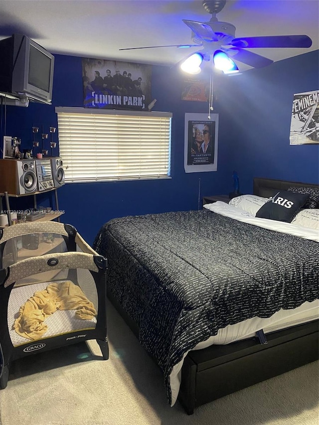 carpeted bedroom with ceiling fan