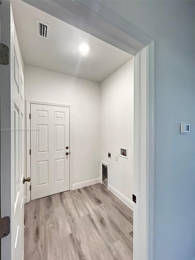 laundry room with washer hookup, light hardwood / wood-style flooring, and hookup for an electric dryer