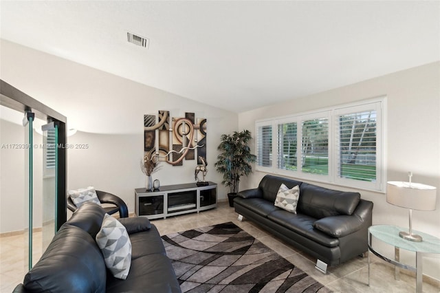 tiled living room featuring lofted ceiling