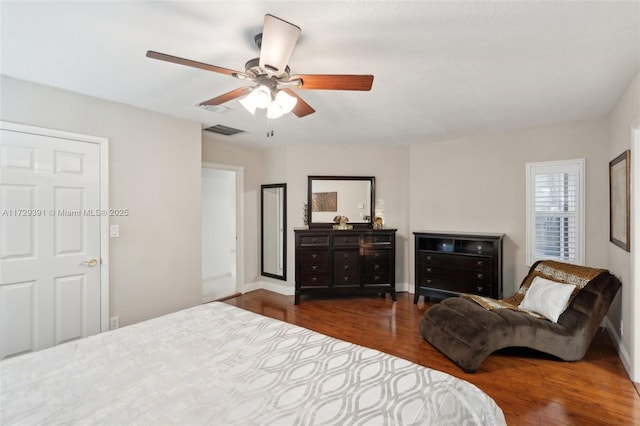 bedroom featuring ceiling fan and dark wood-type flooring