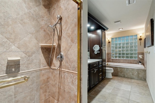 full bathroom featuring toilet, shower with separate bathtub, and vanity