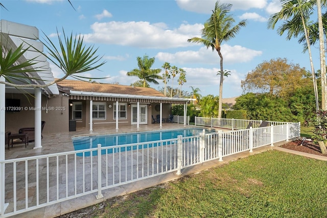 view of pool with an outbuilding and a patio