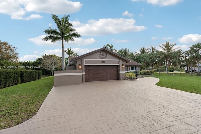 view of front facade featuring a garage and a front lawn