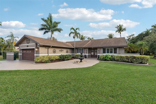 ranch-style house with a garage and a front lawn