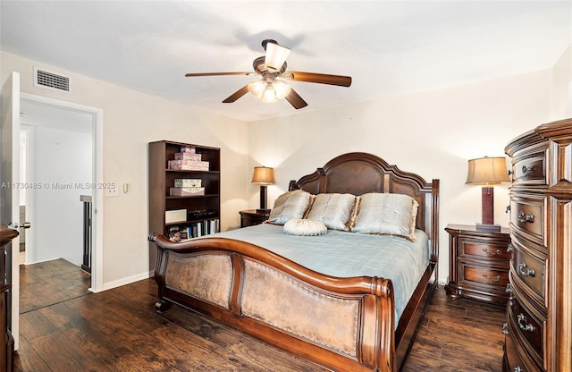 bedroom with dark hardwood / wood-style flooring and ceiling fan