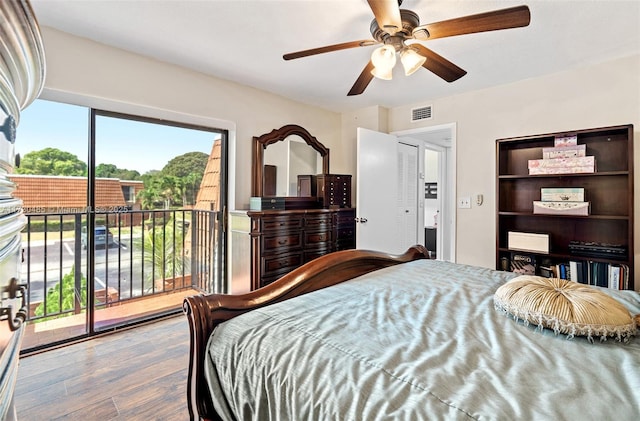 bedroom with hardwood / wood-style flooring, access to outside, and ceiling fan