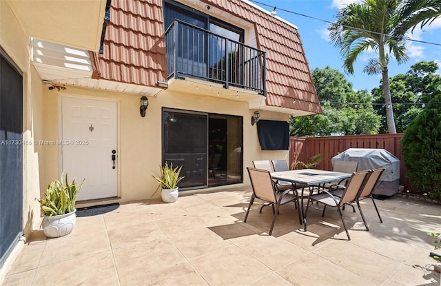 view of patio / terrace featuring grilling area and a balcony