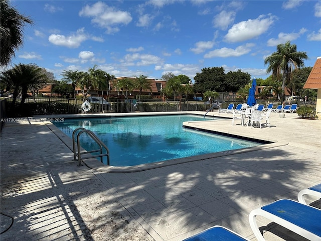 view of swimming pool with a patio area