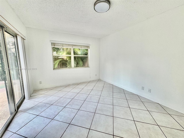 10781 NW 12th Dr, Plantation, FL 33322 - spare room featuring a textured ceiling and light tile patterned floors