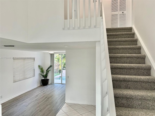 10781 NW 12th Dr, Plantation, FL 33322 - stairs featuring wood finished floors and a towering ceiling