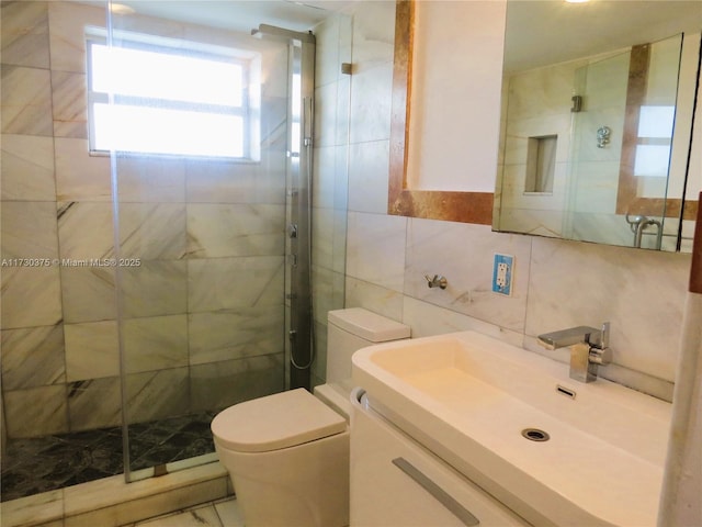 bathroom with tile walls, an enclosed shower, vanity, decorative backsplash, and toilet