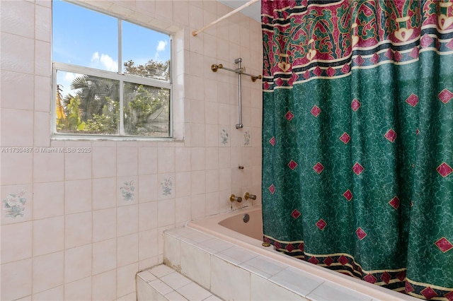 bathroom with shower / tub combo with curtain