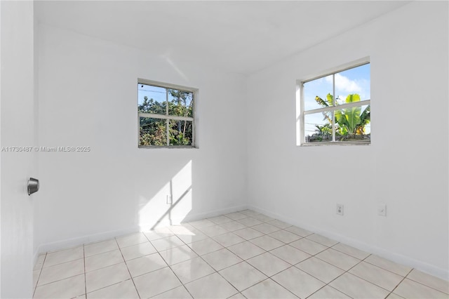 empty room with light tile patterned flooring