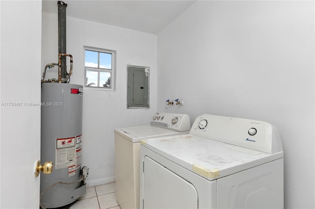 laundry area featuring electric panel, water heater, light tile patterned floors, and separate washer and dryer