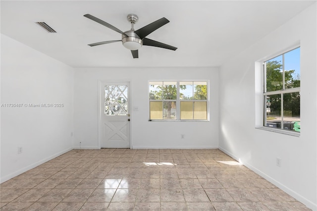 unfurnished room featuring ceiling fan