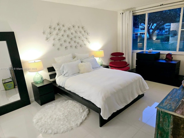 bedroom featuring light tile patterned flooring