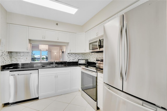 kitchen with sink, white cabinetry, and stainless steel appliances