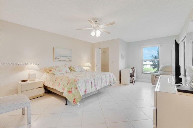 bedroom featuring ceiling fan and light tile patterned floors