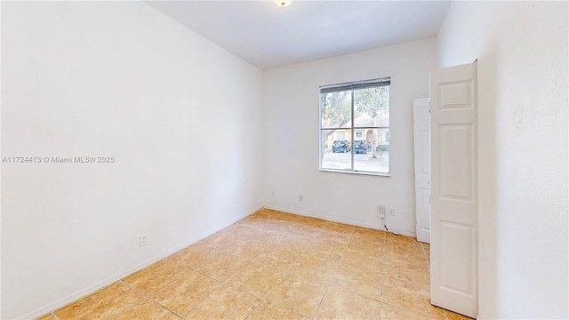 empty room with baseboards