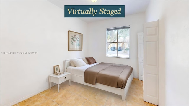 bedroom featuring light tile patterned flooring