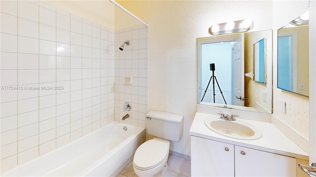 full bathroom featuring vanity, toilet, bathing tub / shower combination, and tile patterned flooring