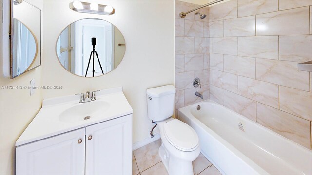 hallway featuring sink and light tile patterned flooring