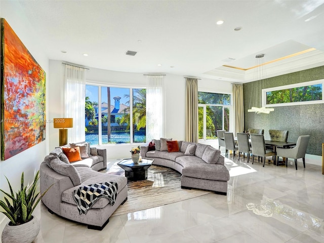 living room with a tray ceiling