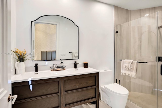 bathroom with an enclosed shower, vanity, and toilet