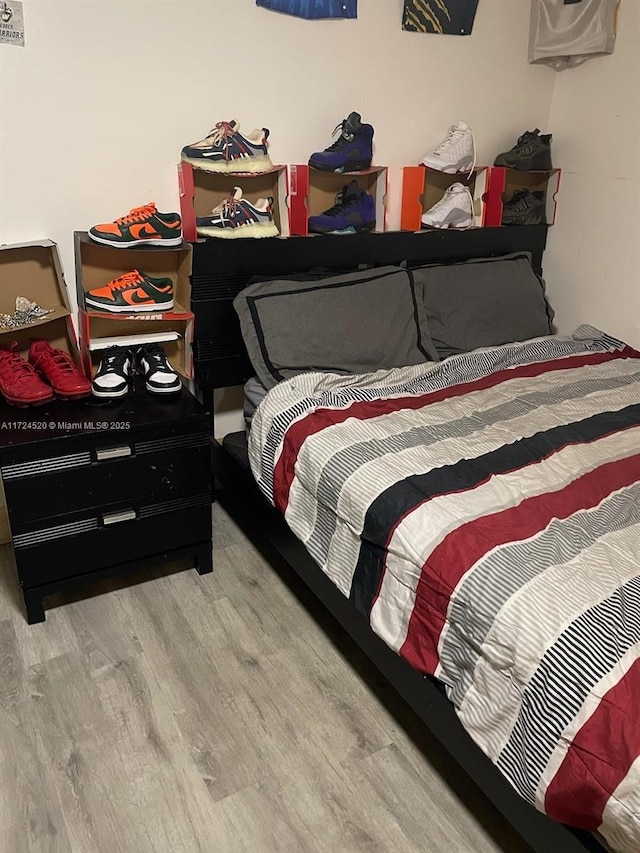 bedroom featuring wood-type flooring