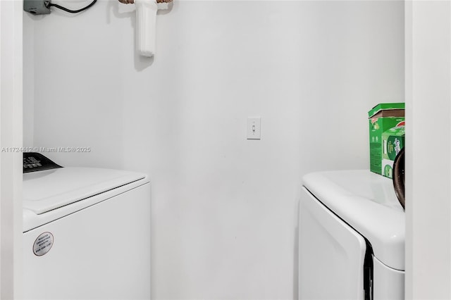 washroom with separate washer and dryer